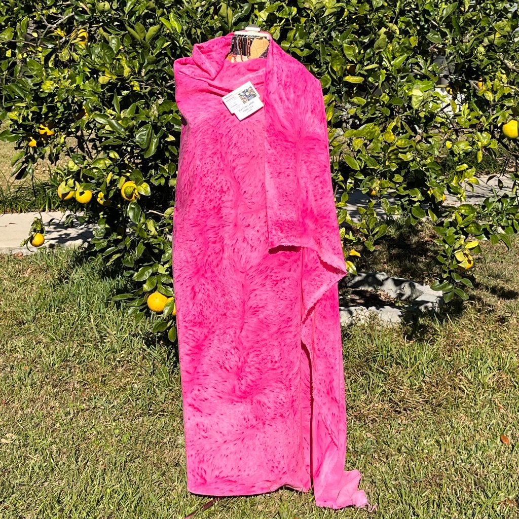 A SPLATTER DYED PINK PIECE OF FABRIC