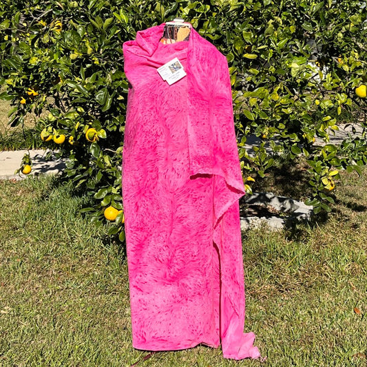 A SPLATTER DYED PINK PIECE OF FABRIC