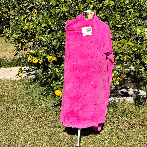 A SPLATTER DYED PINK PIECE OF FABRIC