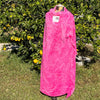 A SPLATTER DYED PINK PIECE OF FABRIC