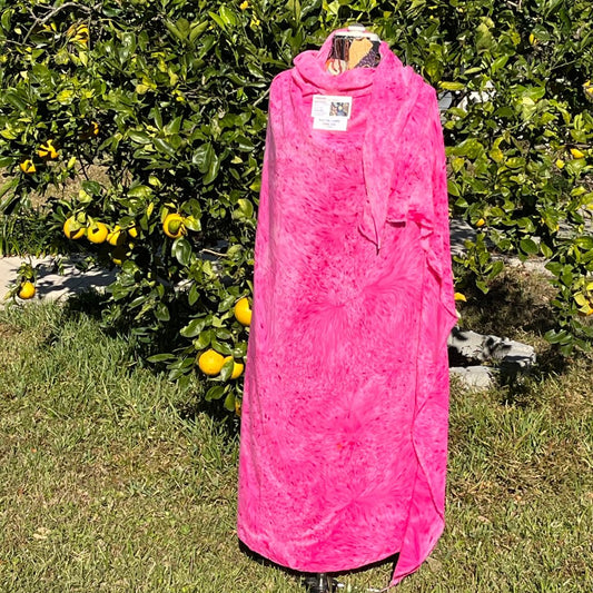 A SPLATTER DYED PINK PIECE OF FABRIC