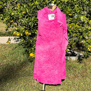 A SPLATTER DYED PINK PIECE OF FABRIC