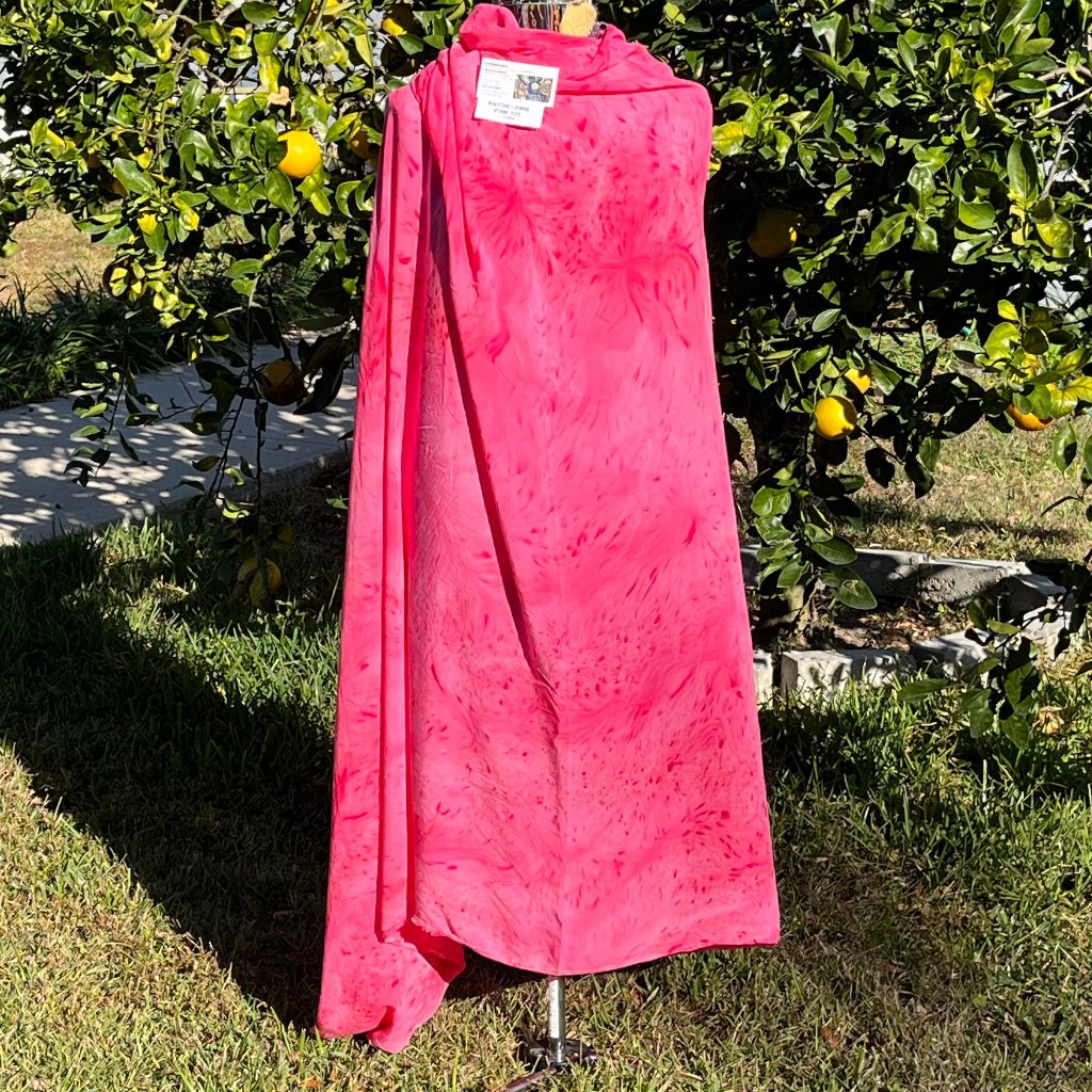 A SPLATTER DYED PINK PIECE OF FABRIC