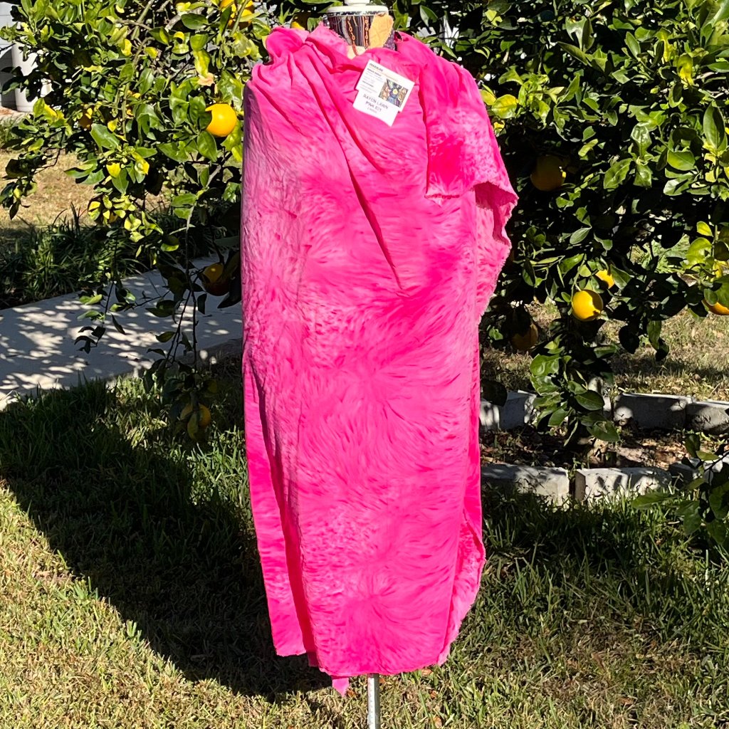 A SPLATTER DYED PINK PIECE OF FABRIC