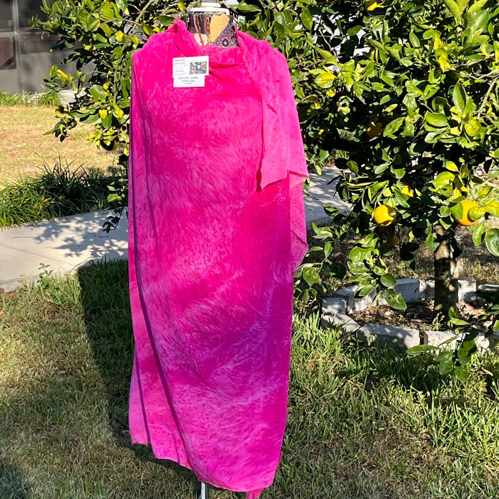 A SPLATTER DYED PINK PIECE OF FABRIC