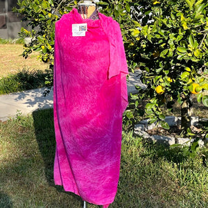 A SPLATTER DYED PINK PIECE OF FABRIC