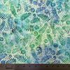 Fern leaf pattern fabric with a ruler at the bottom for scale