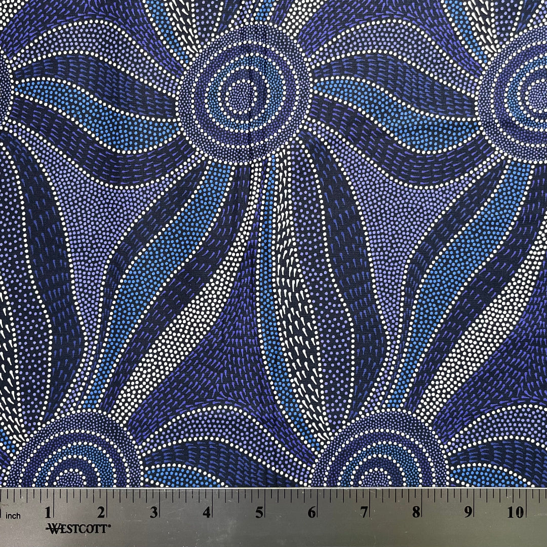 Blue and white patterned fabric with a ruler for scale