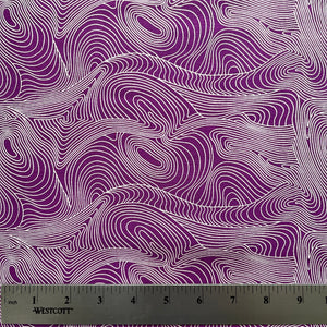 Fabric with purple and white wavy pattern, ruler at the bottom for scale.