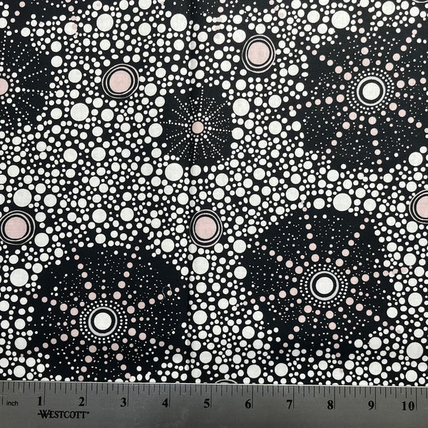 Black and white patterned fabric with a ruler at the bottom
