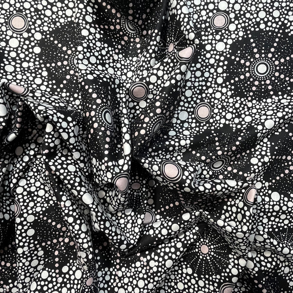 Black and white patterned fabric with circular designs