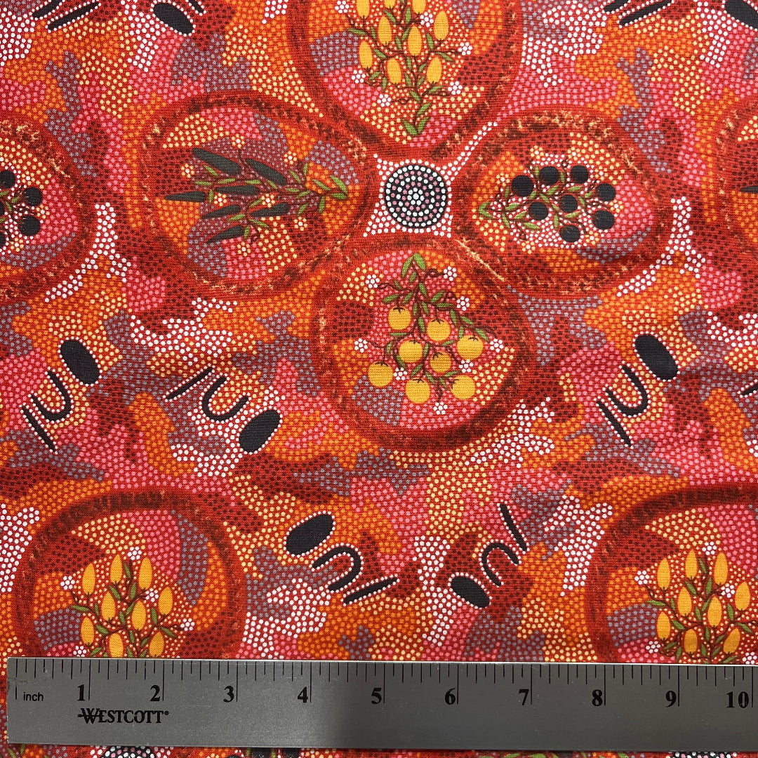 Textile with Aboriginal art pattern and ruler for scale