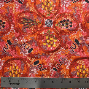 Textile with Aboriginal art pattern and ruler for scale