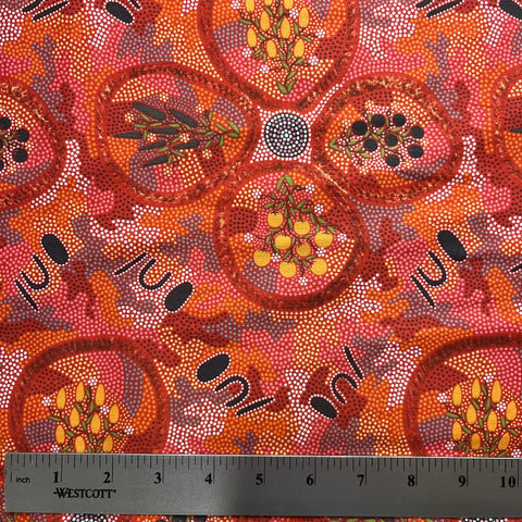 Textile with Aboriginal art pattern and ruler for scale