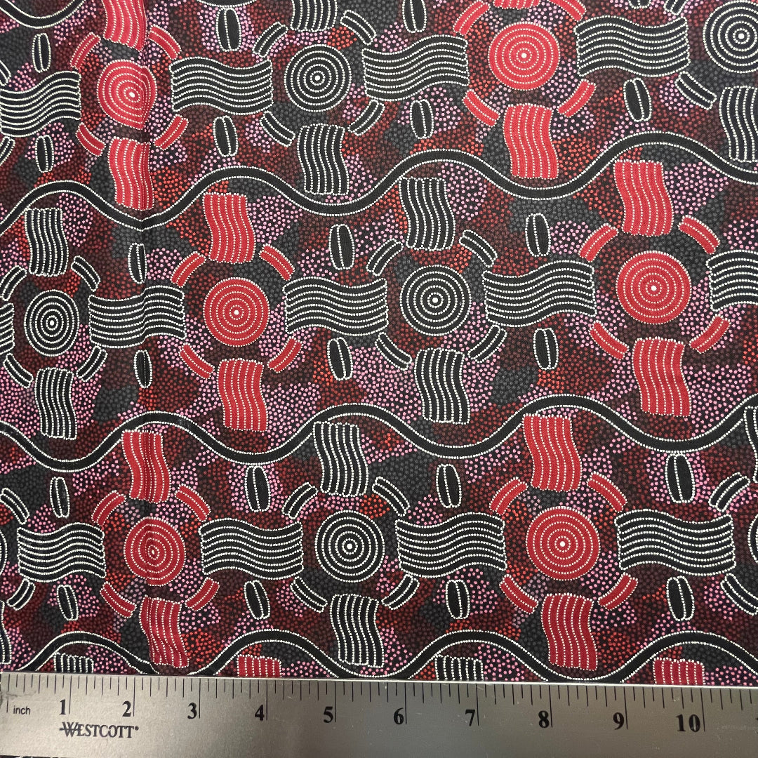 Geometric design in red, black and white with ruler