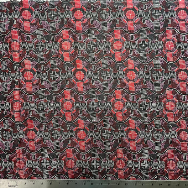 Fabric with a red and black abstract pattern