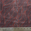 Fabric with red and white pattern and a ruler for scale