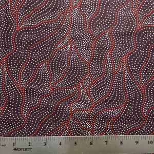 Fabric with red and white pattern and a ruler for scale