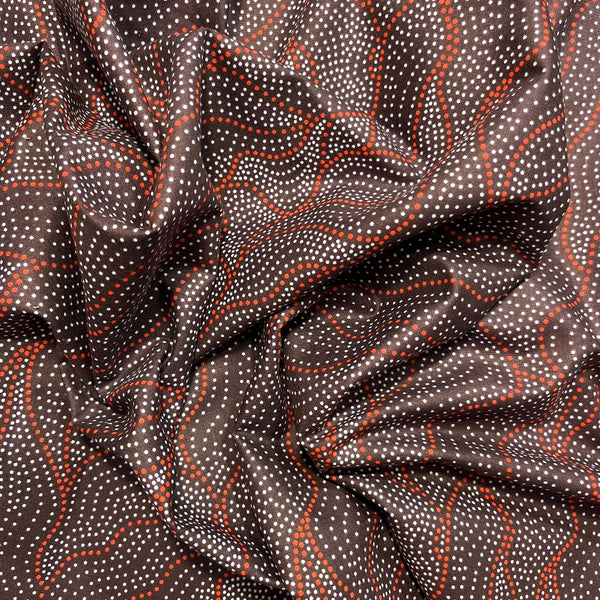 Textured fabric with red and white pattern