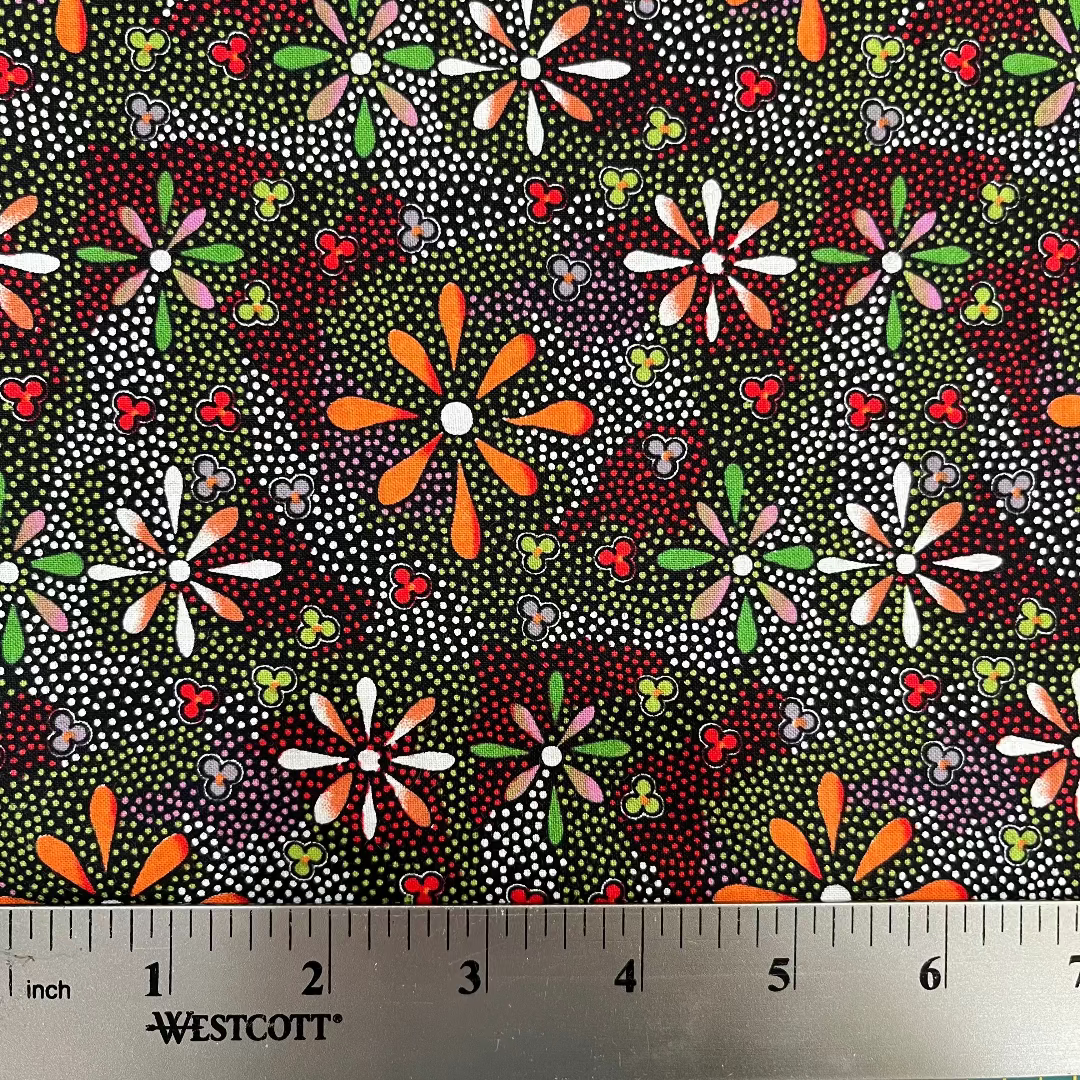 Colorful floral pattern fabric with a ruler for scale, featuring Westcott brand.