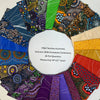 A circular white label reading 'M&S Textiles Australia Autumn 2026 Complete Collection 26 Fat Quarters Measuring 18"x21" each' sits in the center of a fan arrangement of colorful patterned fabric swatches on a light neutral background.