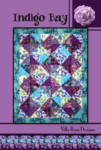 Indigo Bay quilt pattern uses 12 Fat Quarters (6 light, 6 dark) to create half square triangles that are arranged in sparkling blocks set 3x4.