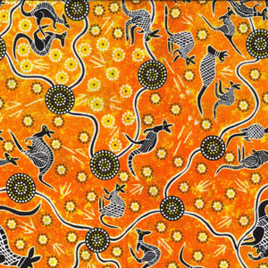 Kangaroo Dreaming 2 orange by G.I. Waitairie features black and white adorned kangaroos on a happy orange background with brilliant yellow flowers.&nbsp;