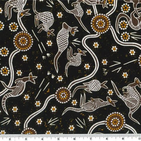 Kangaroo Dreaming 2 tan by G.I. Waitairie features brown and white adorned kangaroos on a dark brown background with tan and white flowers.&nbsp;