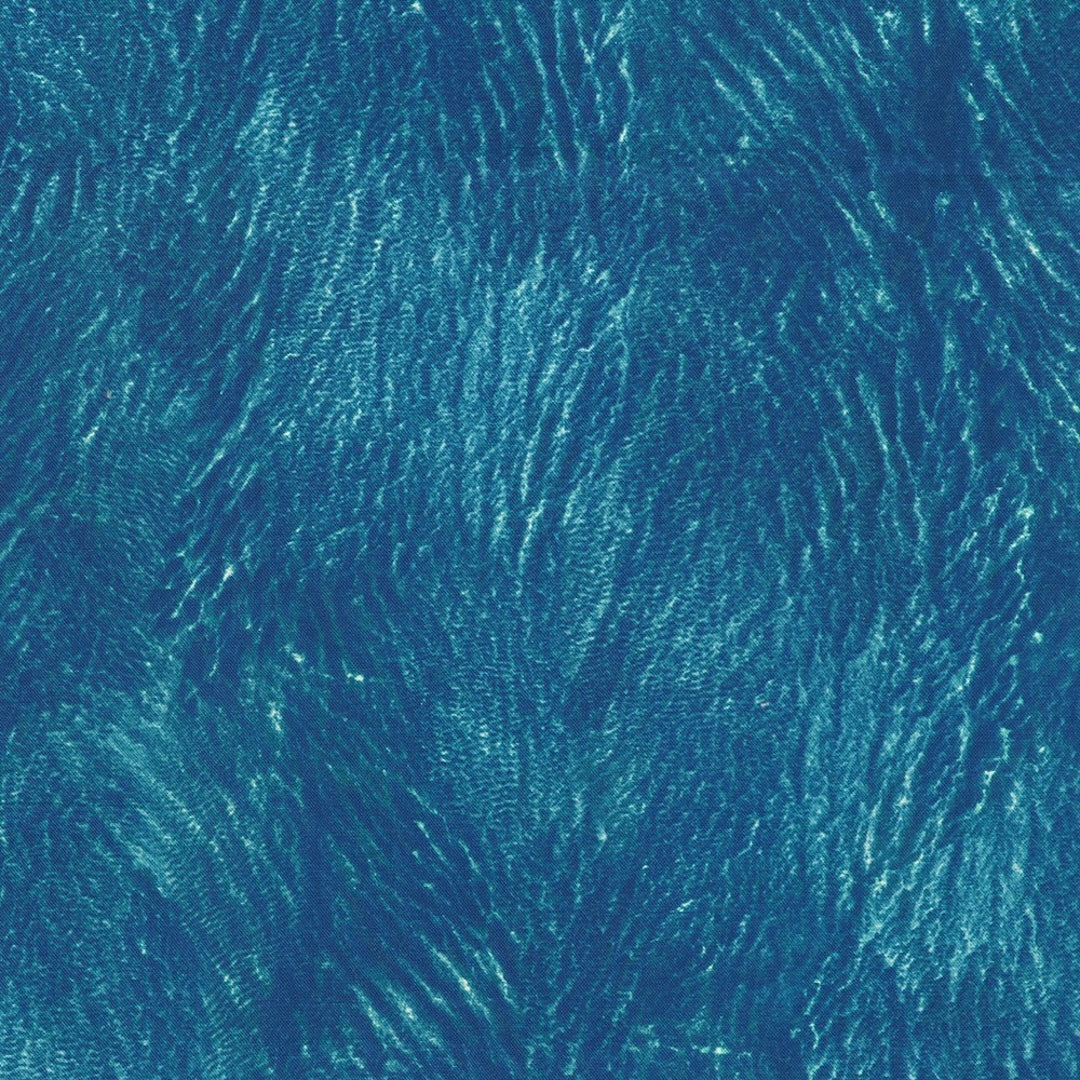 sapphire blue, turquoise, light sea glass ripples on the surface of the water, with tiny white accents
