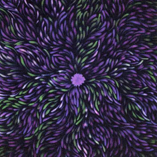 A close-up of a textured fabric featuring a central purple flower surrounded by radiating, curved petal-like lines in purple, violet, and green on a dark background.