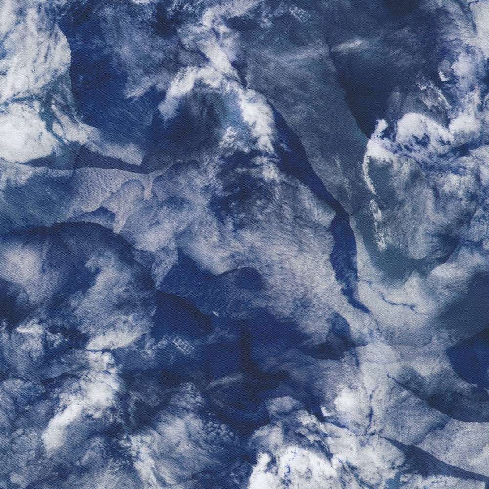  The design looks like a deep dark ocean, partly hidden behind clouds, with ice floating in it (?). 