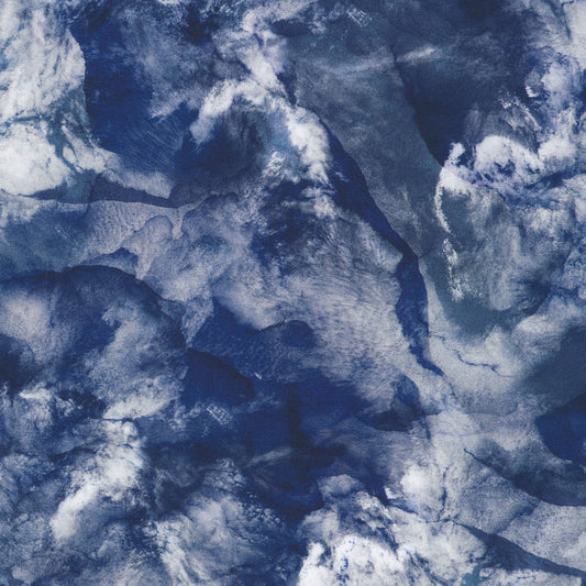  The design looks like a deep dark ocean, partly hidden behind clouds, with ice floating in it (?). 