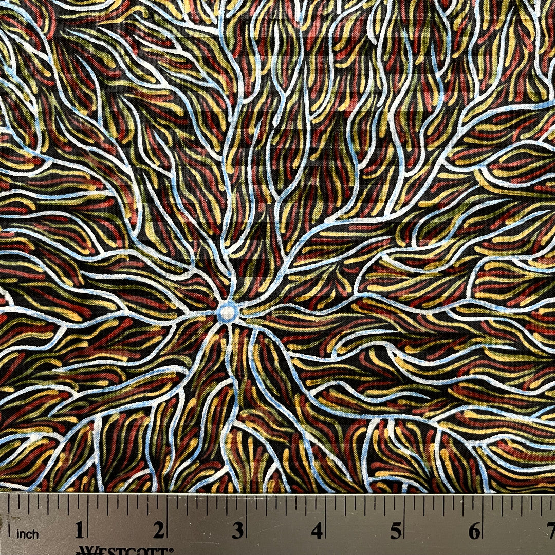 Running Water Dreaming&nbsp; brown is an intricate design of fine lines in white, brown, beige and black, simulating the rivulets of water splashing from a central waterhole.