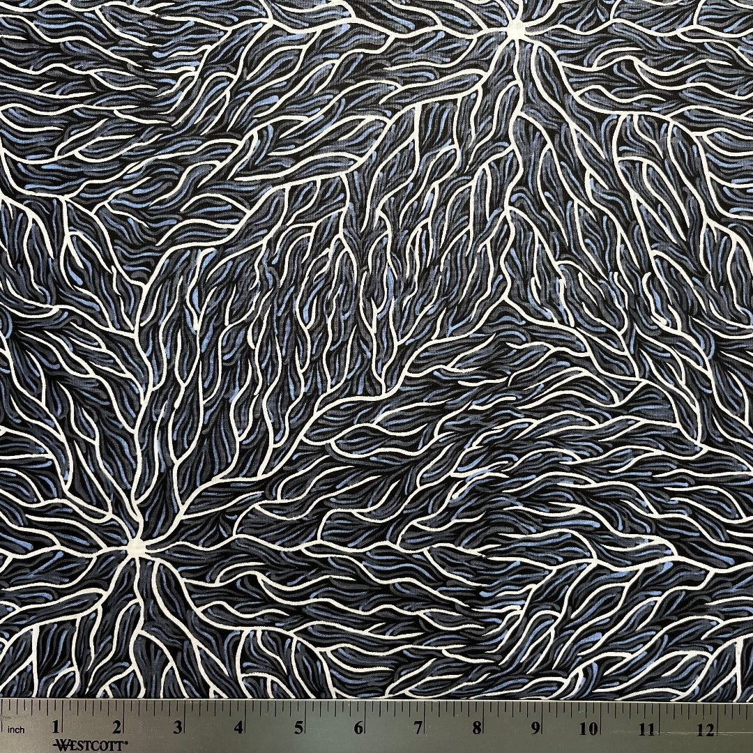 Running Water Dreaming grey is an intricate design of fine lines in white, grey and purplish grey on a black background, simulating the rivulets of water splashing from a central waterhole.