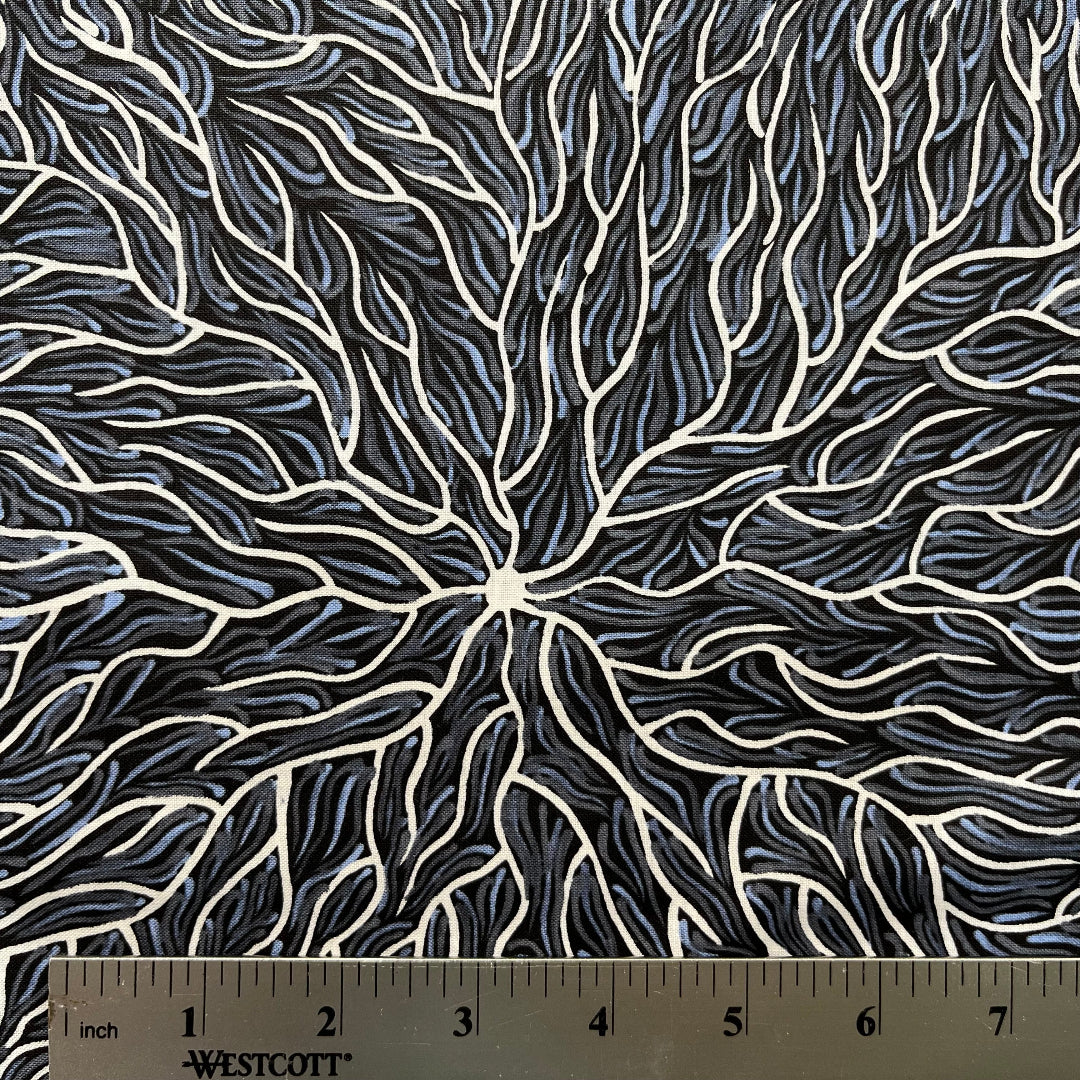 Running Water Dreaming grey is an intricate design of fine lines in white, grey and purplish grey on a black background, simulating the rivulets of water splashing from a central waterhole.