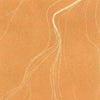 A close-up of a warm tan or camel-colored textured surface with irregular pale dotted lines running across it.