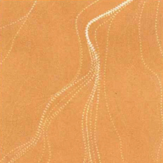A close-up of a warm tan or camel-colored textured surface with irregular pale dotted lines running across it.