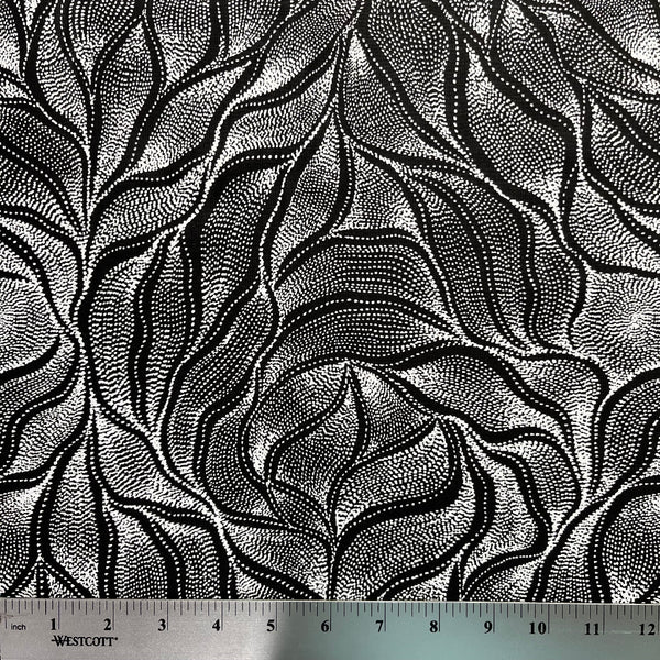 Sandhill and Waterhole Black&nbsp;is a striking design by Aboriginal artist Anna Pitjara, featuring intricate white motifs on a deep black background.