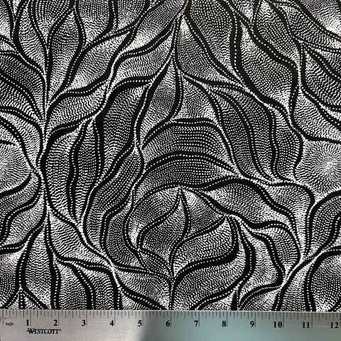 Sandhill and Waterhole Black&nbsp;is a striking design by Aboriginal artist Anna Pitjara, featuring intricate white motifs on a deep black background.