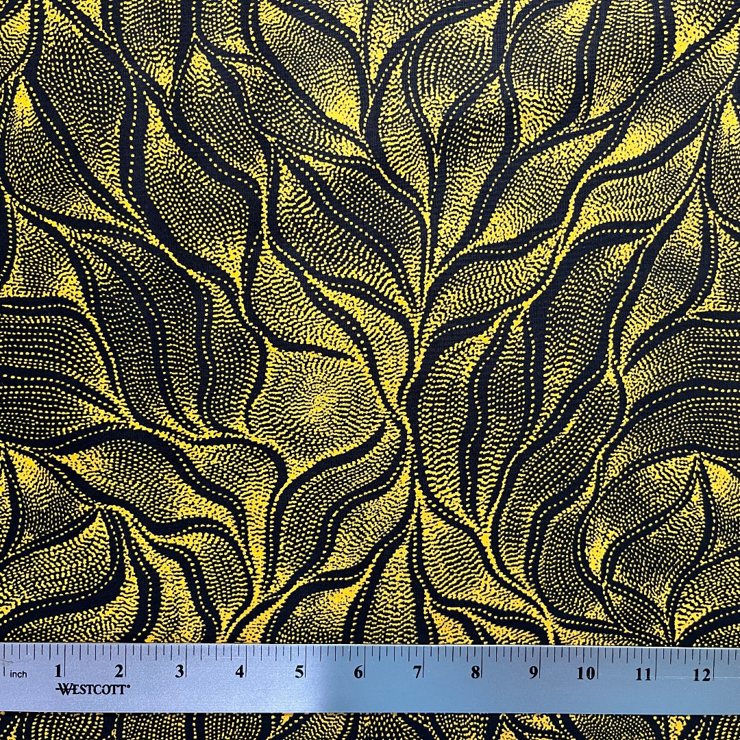 Sandhill and Waterhole Gold&nbsp;is a striking design by Aboriginal artist Anna Pitjara, featuring intricate golden yellow motifs on a deep black background.