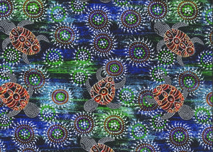 Sea Dreaming blue aboriginal fabric by Australian artist Heather Kennedy is a delightful design of baby turtles in orange on a blue and green background, with round intricate (sand dollar?) shapes thrown in for fun. 