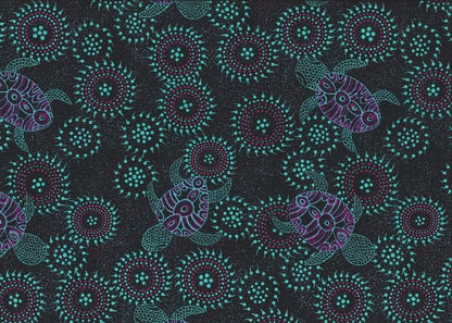 Sea Dreaming emerald aboriginal fabric by Australian artist Heather Kennedy is a delightful design of baby turtles in emerald and purple on a very dark background, with round intricate (sand dollar?) shapes in glowing emerald thrown in for fun. 