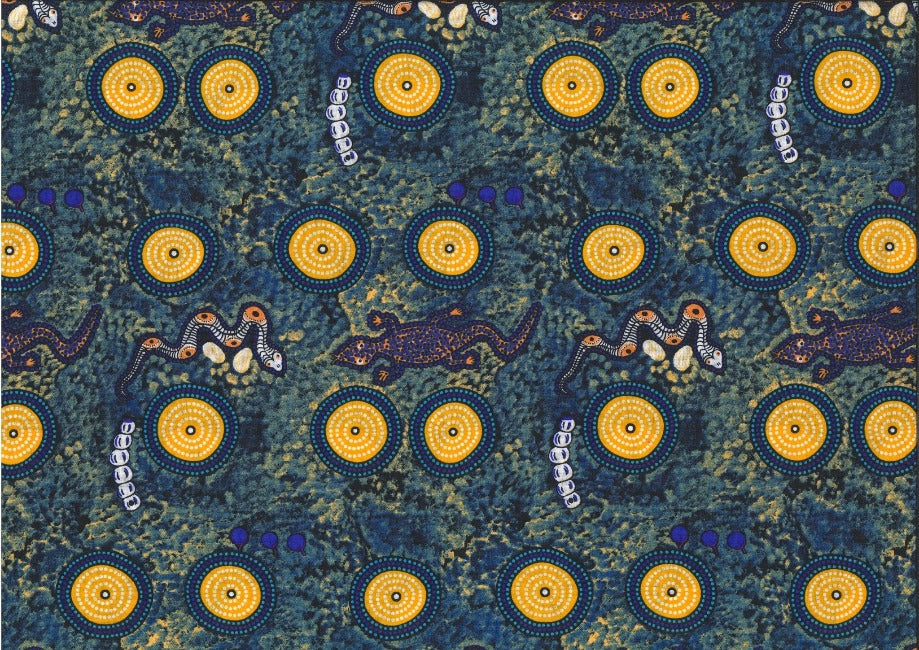 Snake Goanna Bush Tucker blue Australian fabric by Wally Evans is a quirky design, featuring goannas, snakes, berries and grubs in blues and sunny orange on a blue-grey and yellow background, with blue and yellow circles (water holes?) completing the picture. 