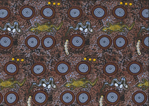 Snake Goanna Bush Tucker blue Australian fabric by Wally Evans is a quirky design, featuring goannas, snakes, berries and grubs in ecru, yellow and light blue on a brown and greybackground, with red and grey circles (water holes?) completing the picture. 