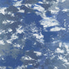 medium blue water, storm clouds in white and shades of gray
