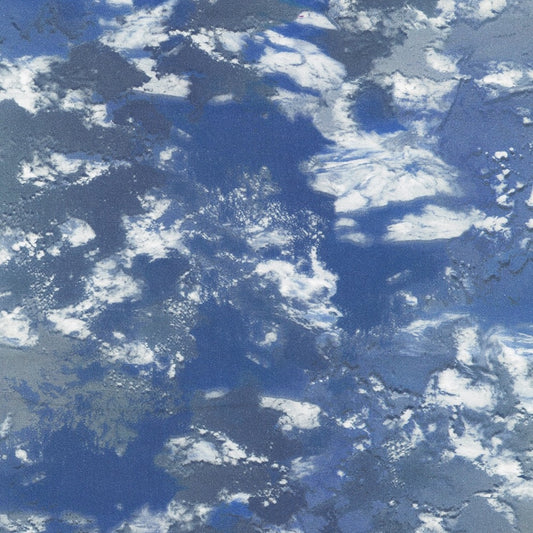 medium blue water, storm clouds in white and shades of gray
