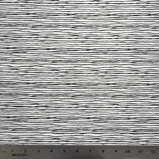 A very simple yet interesting design in black on a white background, looking like strands of string, designed by Kim Schafer.