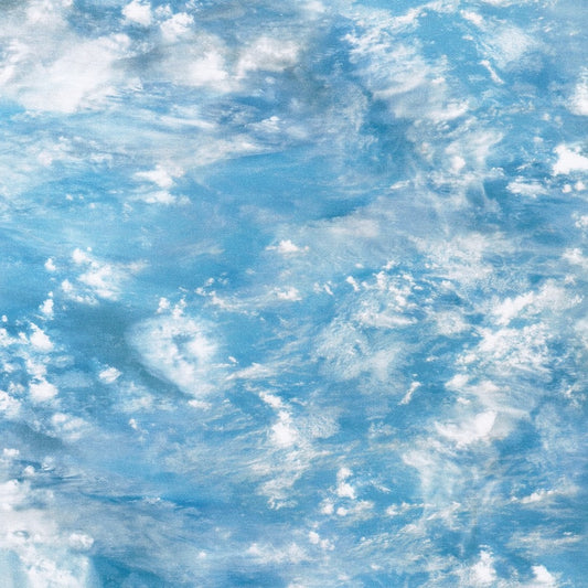 shallow water turquoisey blue with white foam tops of the waves