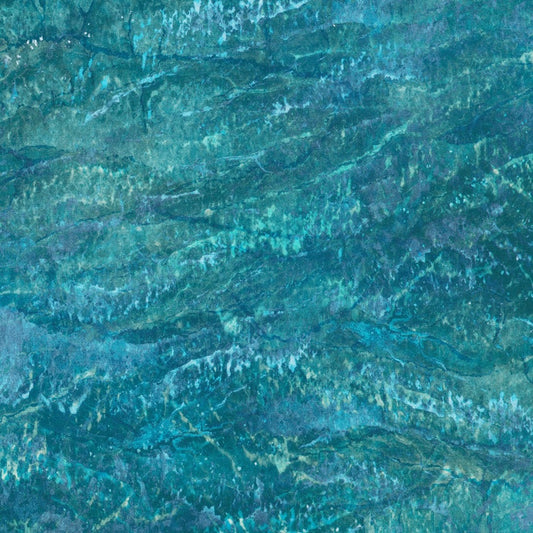 The gorgeous blend of teal, navy, dusty blue, and turquoise creates an enchanting color palette that'll make everyone ask where you found such magic.