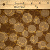 A texture design of circles formed by tiny dots in tans and browns.&nbsp;